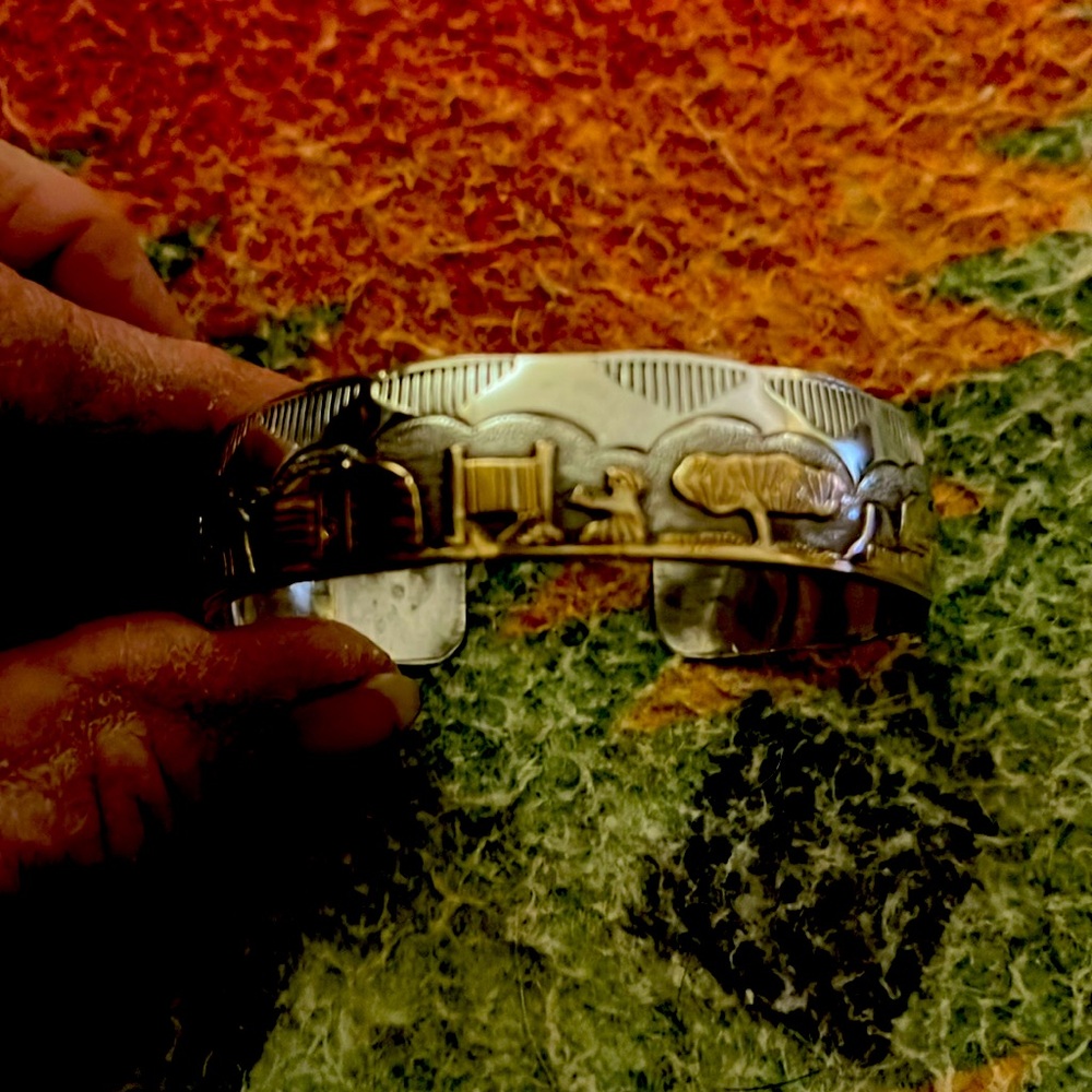 Beautiful storyteller gold and silver bracelet